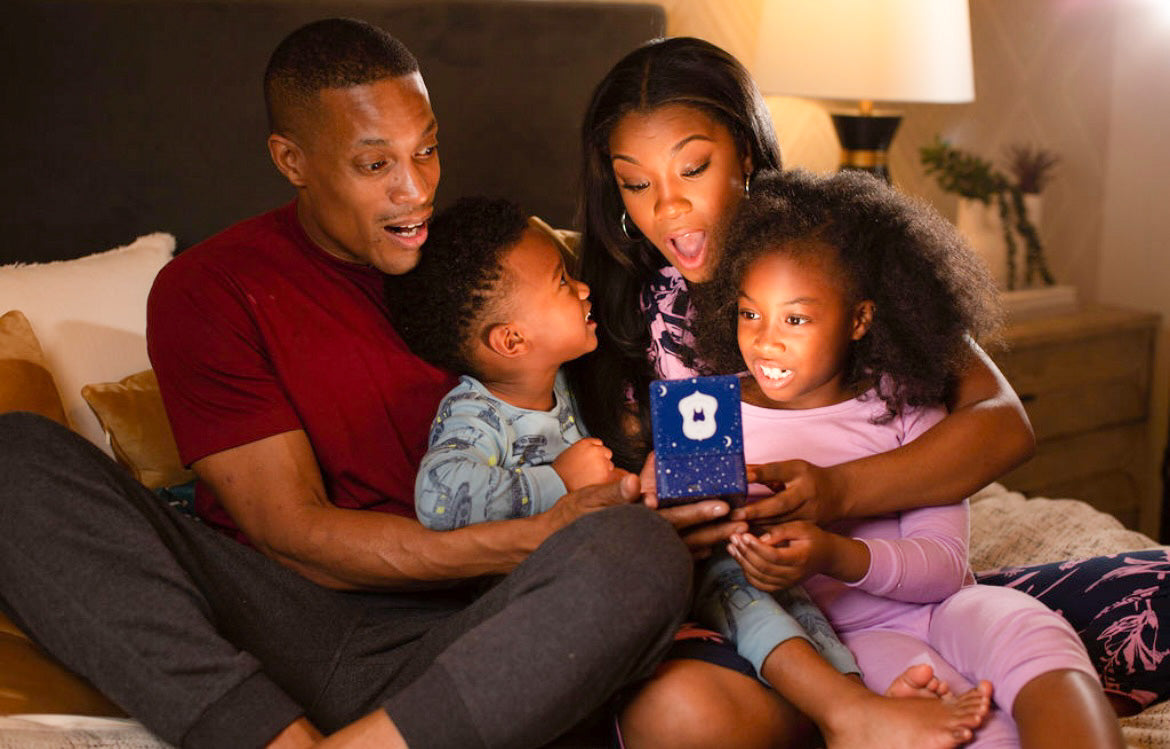 Family opening magical tooth fairy box