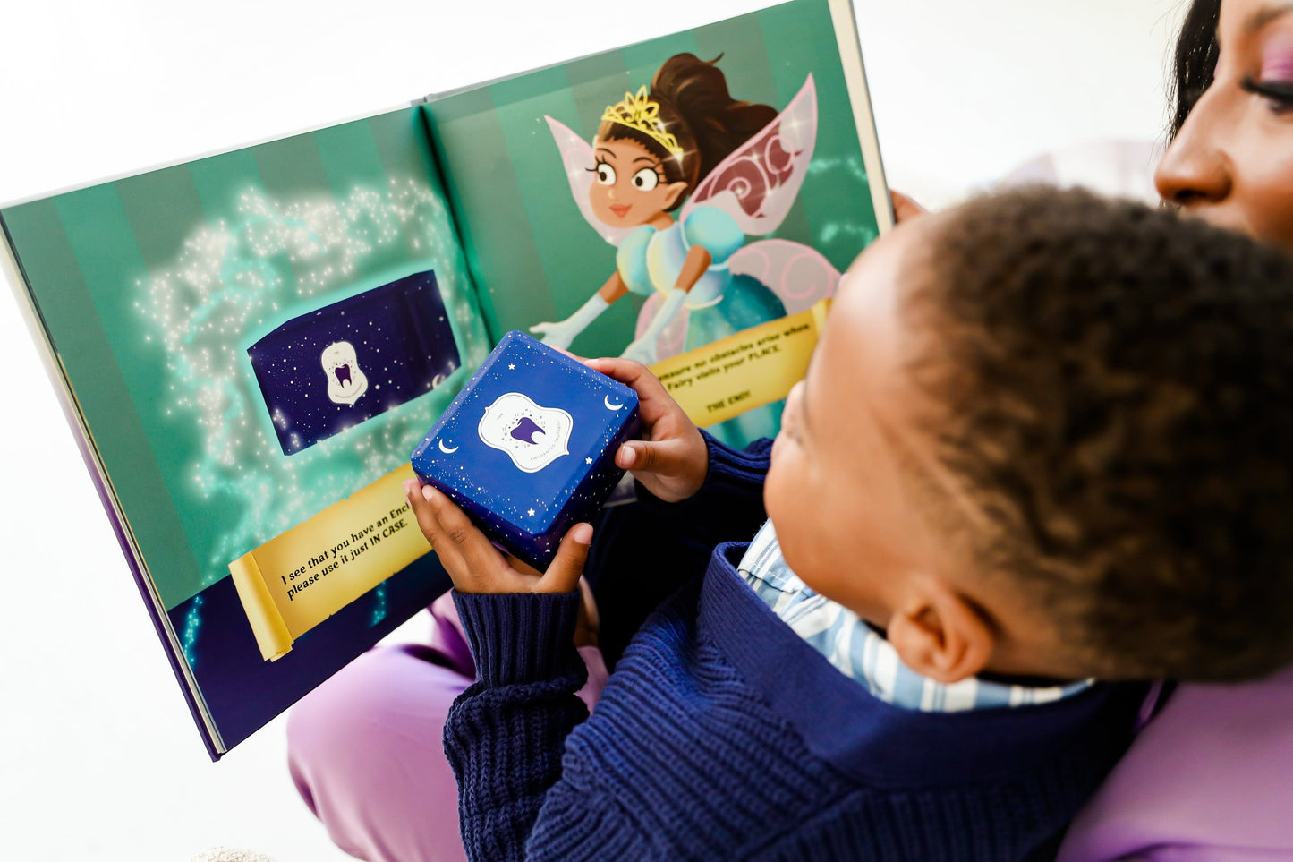 Mother and child with tooth box and book