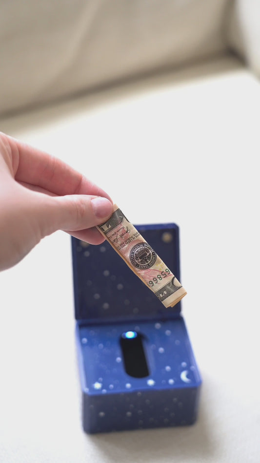 Hands holding starry Tooth Fairy Box